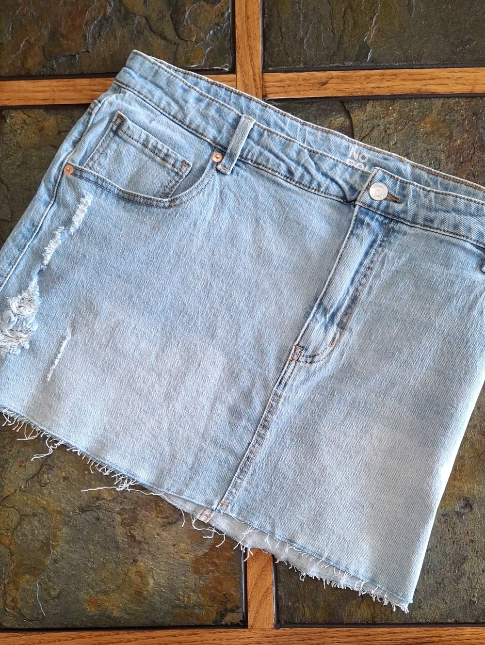 Light Wash Distressed Denim Mini Skirt with Raw Hem
